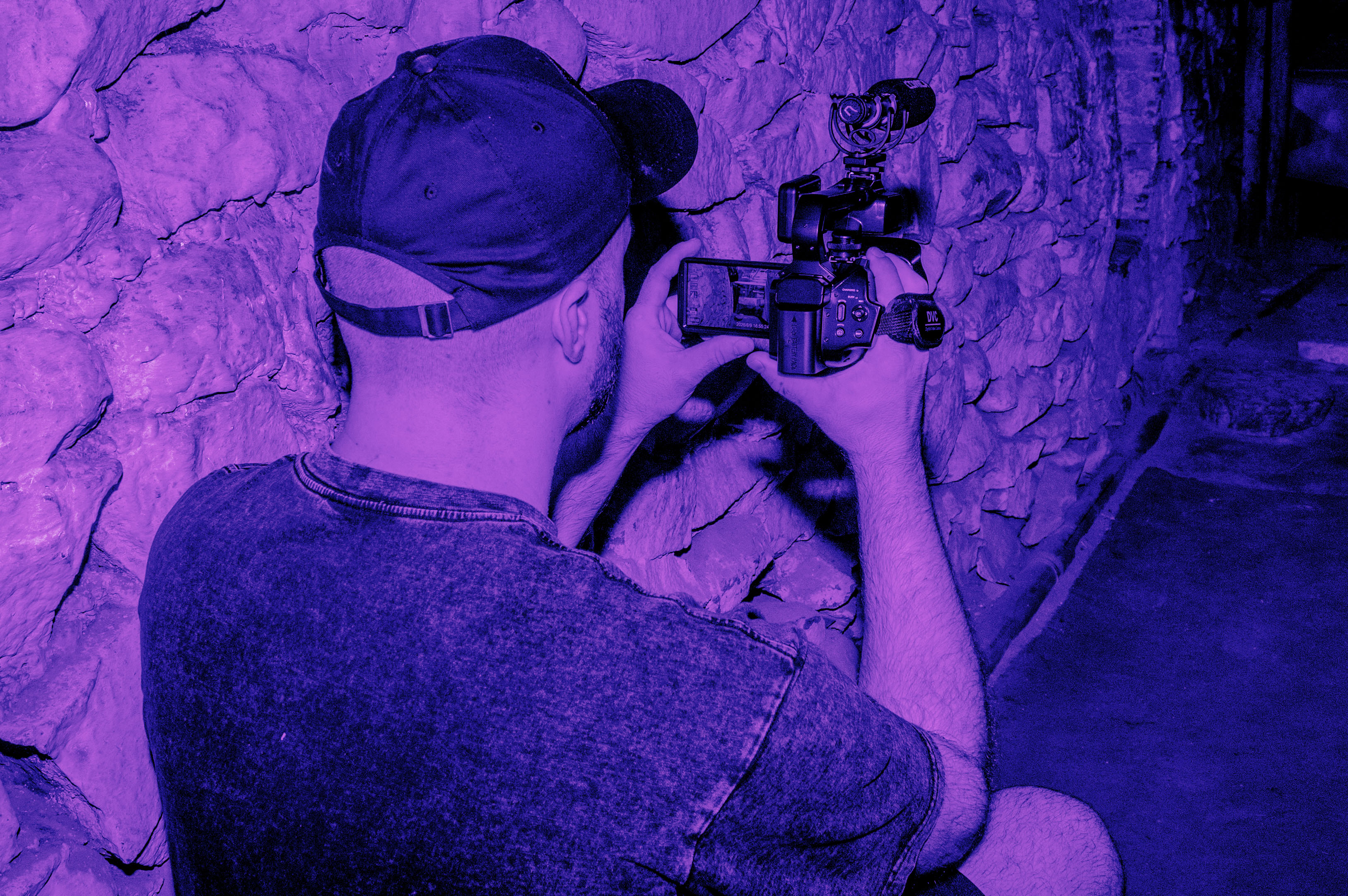 Pharos Paranormal Society team member working with investigation equipment
