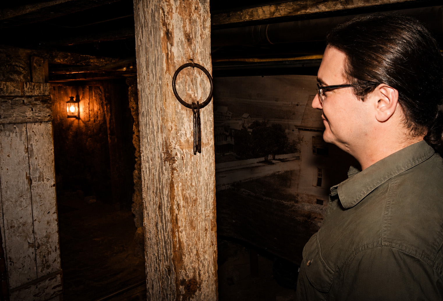 Pharos Paranormal Society team member working with investigation equipment